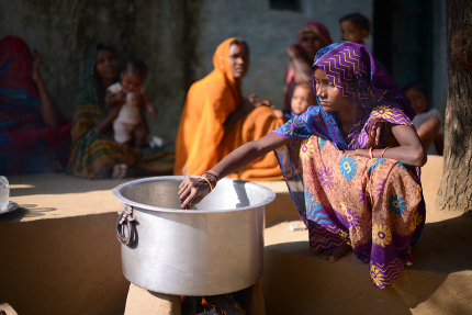 indian woman cooking a meal